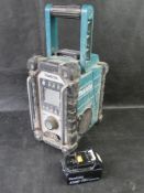 A Makita radio and battery.