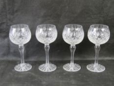 A set of four Thomas Webb crystal wine glasses.
