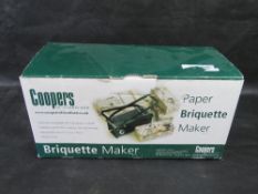 A paper briquette maker.
