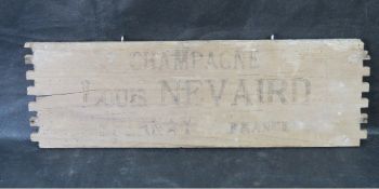 A decorative champagne sign made from a vintage transport box,