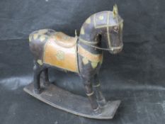 A tabletop wooden rocking horse figure