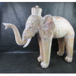 A large and impressive carved wooden elephant standing approx 90cm high.