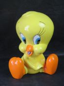 A Warner Bros Tweety Pie money box with stopper, c1990s.