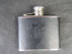 An Aston Martin branded hip flask.