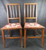 A pair of Edwardian hall chairs.