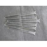 A set of six glass drinks stirrers.