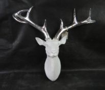 A white and silver wall mounted 'stags head'.