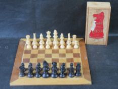 A Staunton box wood chess set with associated board.