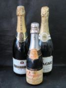 Mercier Demi-Sec Champagne, and two other sealed bottles.