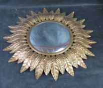 A retro style 'sun' wall mirror.