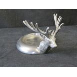 A Culinary Concepts stag head wine bottle coaster.