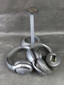 Two pairs of headphones and wireless charger.