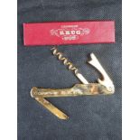 A Krug Champagne bottle opener in original box.