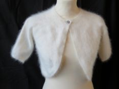A contemporary angora cardiagan, together with a long line fluffy cardigan.