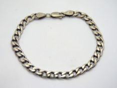 A hallmarked silver curb link bracelet, 17.2g.