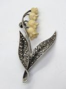 A delightful marcasite set brooch in the form of Lily of the Valley having carved antler flowers.