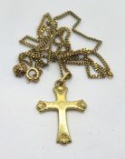A 9ct gold cross on chain, chain hallmarked 375, cross stamped 375, total weight 3.3g.