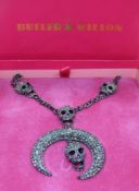 Butler & Wilson; skull and crescent moon necklace in original box.