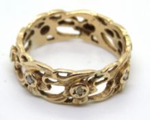 A 14ct gold floral pattern ring, stamped 14k, size W, 6.