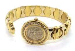 A ladies 18ct gold wristwatch having sprung 18ct gold strap and diamond encrusted dial,