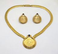 A vintage Franklin Mint 'Cleopatra' Egyptian Revival coin necklace and earrings set.