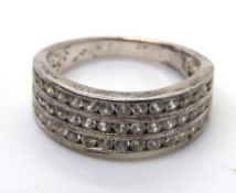 A 925 silver ring, three rows of white stones, size K.