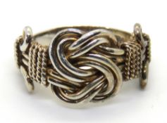 A silver knot style ring, size K.