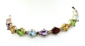 A silver and multi colour stone bracelet, hallmarked 925.