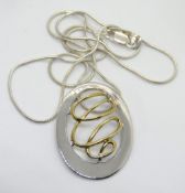 A silver pendant on chain, stamped 925, pendant 33mm in length.