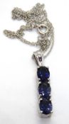 A silver and tanzanite pendant, on chain, stamped 925.