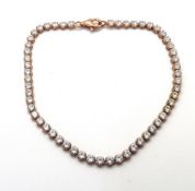 A silver and white stone bracelet, stamped 925.