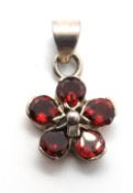 A 925 silver and red stone floral pendan