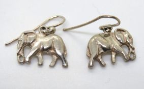 A pair of elephant earrings, no apparent