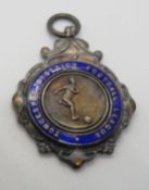 A hallmarked silver and blue enamel meda
