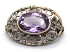 A silver and amethyst brooch, 25mm wide.