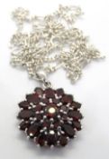 A silver red stone cluster pendant, stamped 925, on silver chain, 32mm inc bale.