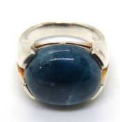 A silver and blue stone cabachon ring,