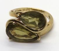 A 9ct gold ring having twin pear cut quartz stones, hallmarked 375, size K-L, 3.