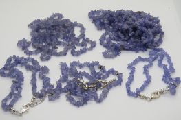 Two blue stone chip necklaces with two matching bracelets, bracelets having 925 silver clasps.