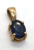 A solitaire sapphire pendant, oval cut, set in 9ct gold hallmarked 375, 13mm inc bale, 0.7g.