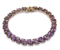 A substantial silver and amethyst cluster bracelet, hallmarked 925, 19.8g.