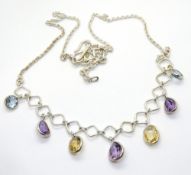 A 925 silver necklace having various coloured stone drops upon.