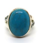 A silver and turquoise ring, size J/K.