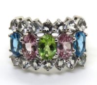 A silver multi colour stone ring,