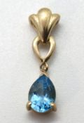 A 9ct gold and pear cut topaz pendant, stamped 375, 20mm inc bale, 0.9g.