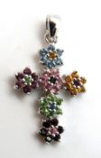 A floral cross set with various coloured stones, 28mm inc bale.