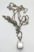 A silver white stone pendant on chain, stamped 925.