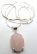 A silver and rose quartz pendant, stamped 925, 37mm inc bale, on silver chain.