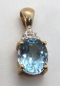A 9ct gold Topaz and diamond pendant approx 20mm inc bale, hallmarked 375, 2.1g.