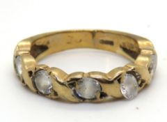 A 9ct gold half eternity band, hallmarked 375, size F, 2g.